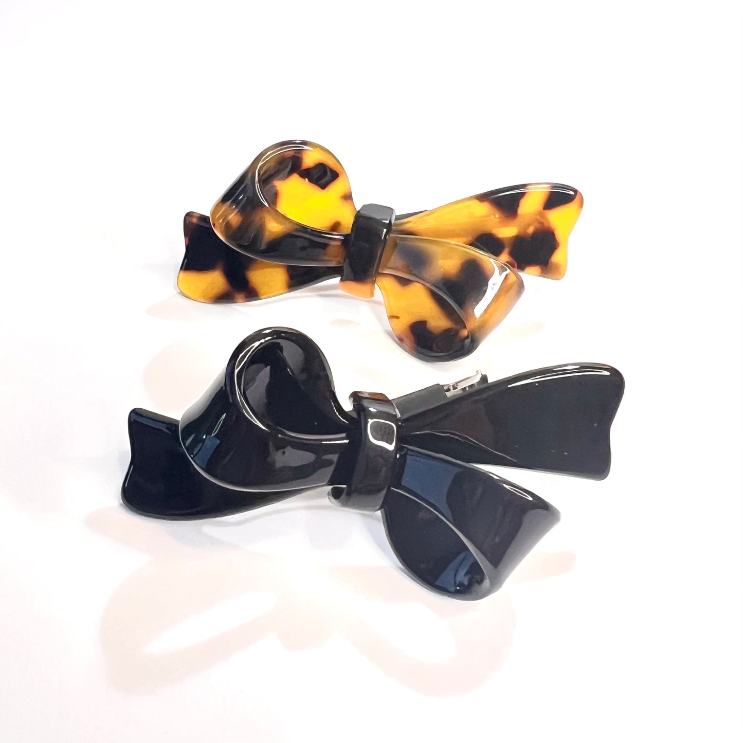 “Elevate your style with our Deluxe Mini French Barrette Duo in Classic Black and Elegant Tortoise, each 2.5 inches long.”