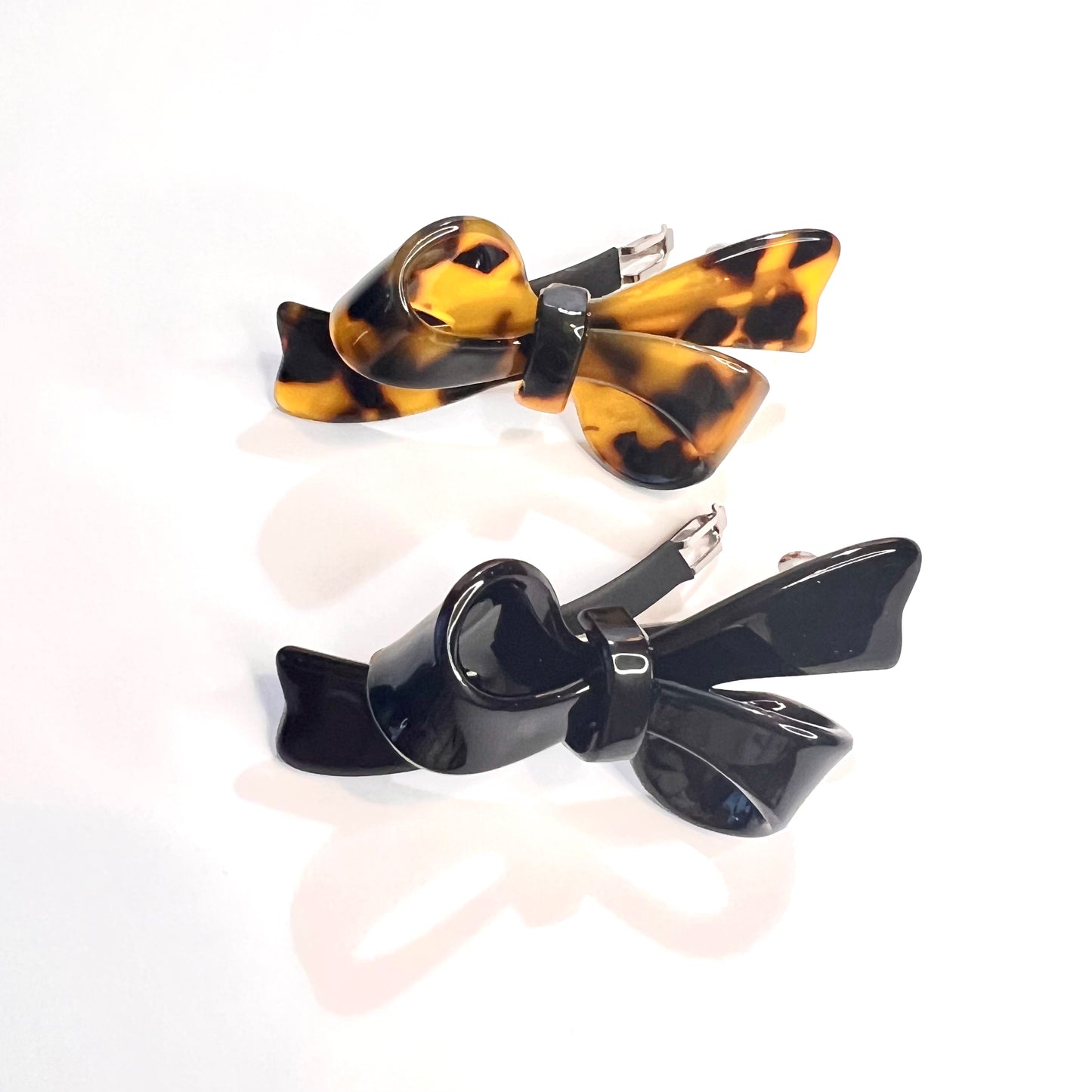 “Elevate your style with our Deluxe Mini French Barrette Duo in Classic Black and Elegant Tortoise, each 2.5 inches long.”