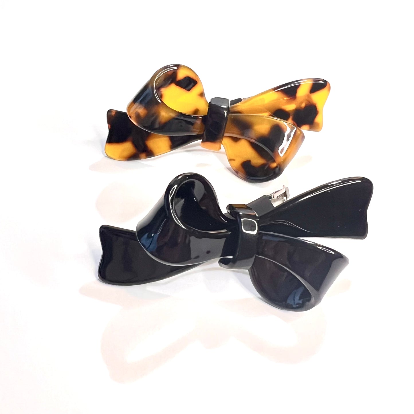 “Elevate your style with our Deluxe Mini French Barrette Duo in Classic Black and Elegant Tortoise, each 2.5 inches long.”