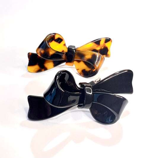 “Elevate your style with our Deluxe Mini French Barrette Duo in Classic Black and Elegant Tortoise, each 2.5 inches long.”